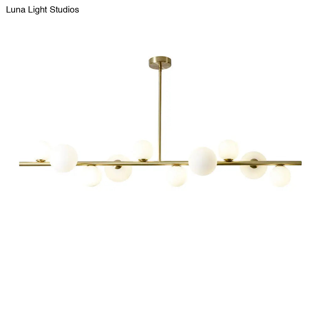 Lámpara colgante DecorBites™ contemporánea de metal dorado con esfera de cristal para mesa de comedor