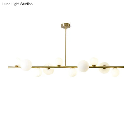 Lámpara colgante DecorBites™ contemporánea de metal dorado con esfera de cristal para mesa de comedor