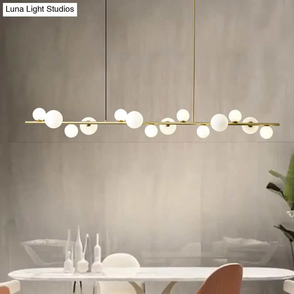 Lámpara colgante DecorBites™ contemporánea de metal dorado con esfera de cristal para mesa de comedor