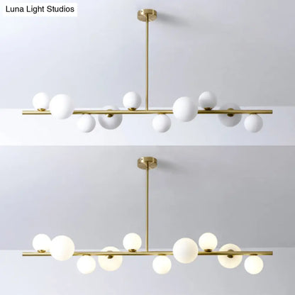 Lámpara colgante DecorBites™ contemporánea de metal dorado con esfera de cristal para mesa de comedor