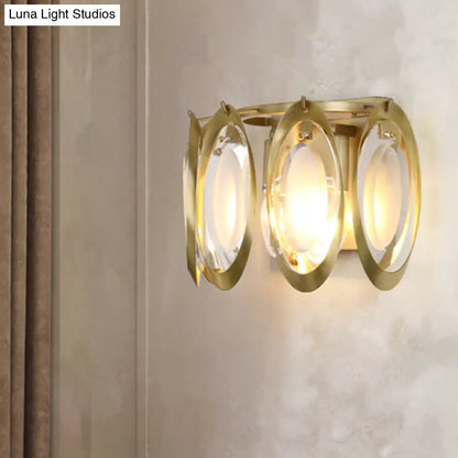 Aplique ovalado dorado contemporáneo DecorBites™ con detalle de cristal tallado: la lámpara de pared perfecta para la iluminación del salón.