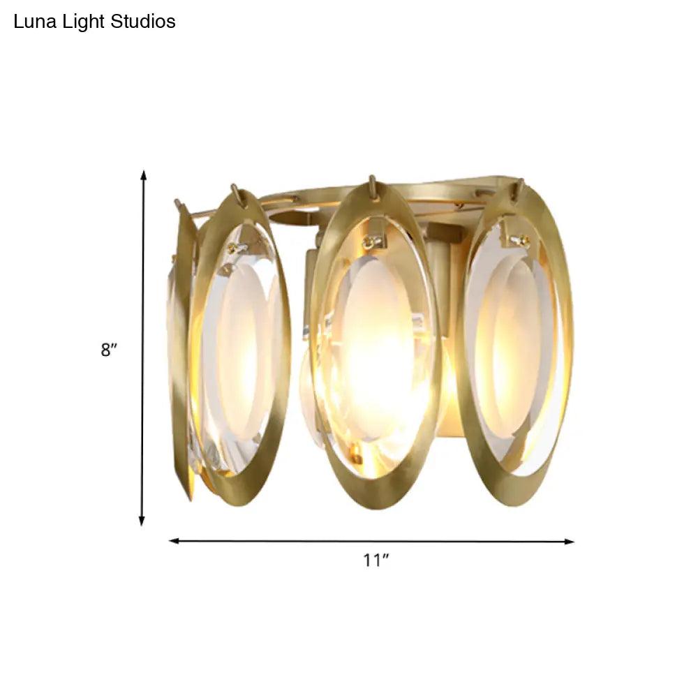 Aplique ovalado dorado contemporáneo DecorBites™ con detalle de cristal tallado: la lámpara de pared perfecta para la iluminación del salón.