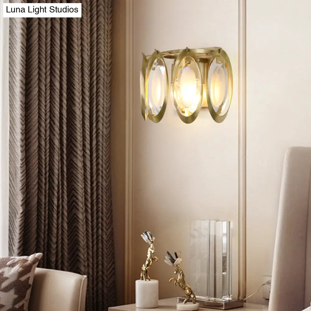 Aplique ovalado dorado contemporáneo DecorBites™ con detalle de cristal tallado: la lámpara de pared perfecta para la iluminación del salón.