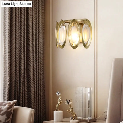 Aplique ovalado dorado contemporáneo DecorBites™ con detalle de cristal tallado: la lámpara de pared perfecta para la iluminación del salón.