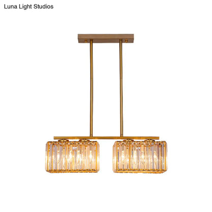 Lámpara colgante contemporánea dorada DecorBites™ para comedor: lámpara lineal metálica para isla con pantalla de cristal cuboide transparente