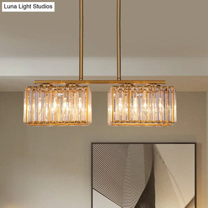 Lámpara colgante contemporánea dorada DecorBites™ para comedor: lámpara lineal metálica para isla con pantalla de cristal cuboide transparente