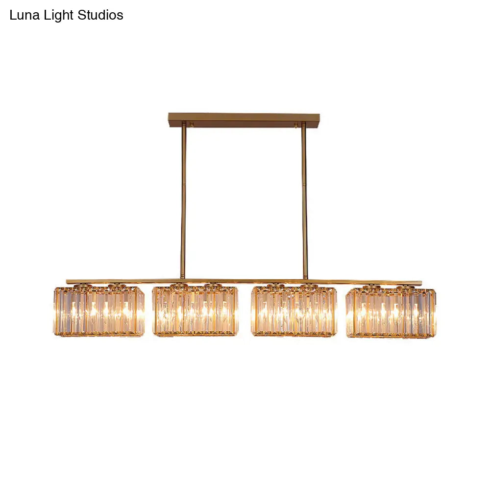 Lámpara colgante contemporánea dorada DecorBites™ para comedor: lámpara lineal metálica para isla con pantalla de cristal cuboide transparente