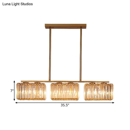 Lámpara colgante contemporánea dorada DecorBites™ para comedor: lámpara lineal metálica para isla con pantalla de cristal cuboide transparente