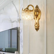 Contemporary gold wall lamp with clear crystal prism and dangling droplets suitable for corridor lighting