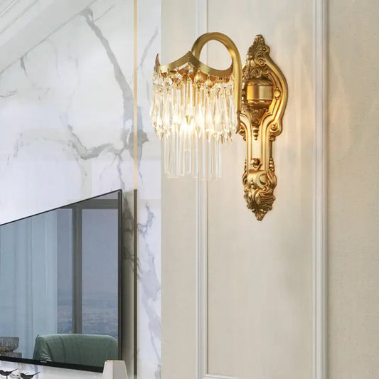 Contemporary gold wall lamp with clear crystal prism and dangling droplets suitable for corridor lighting
