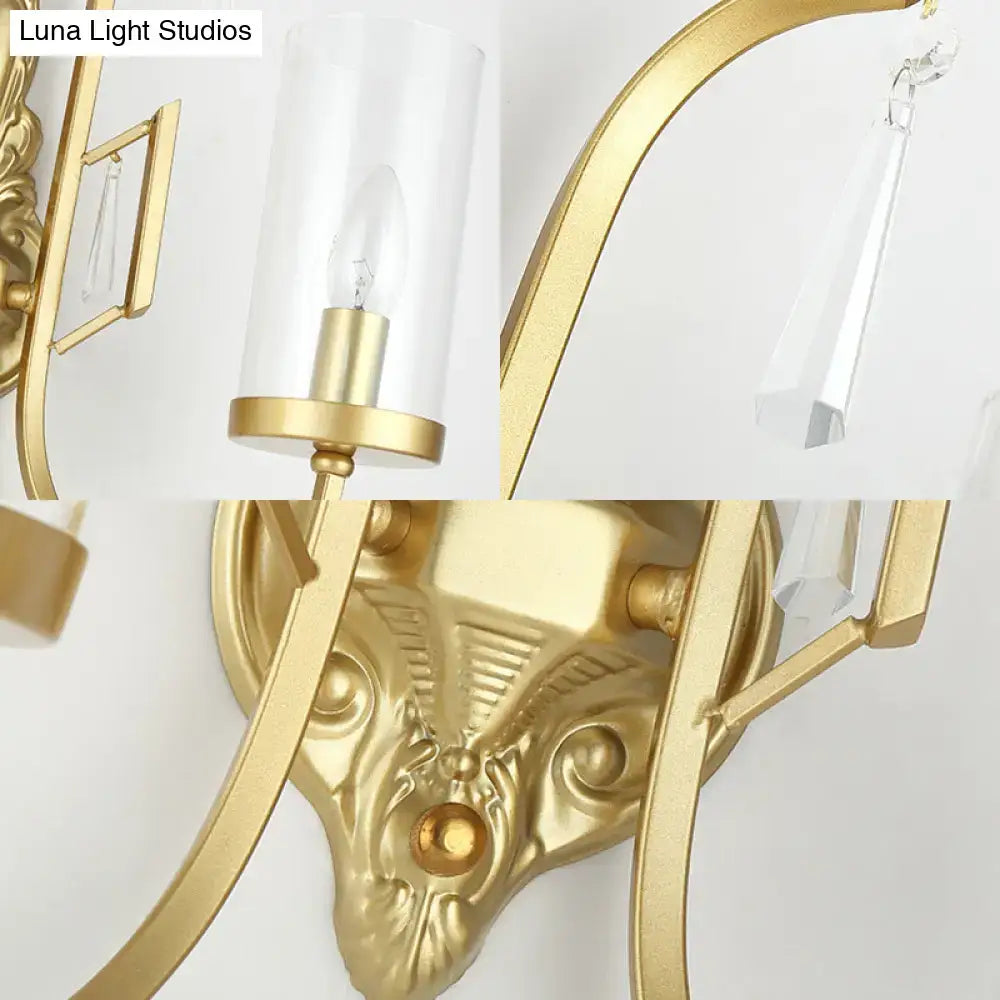 Contemporary gold wall light bedroom sconce with clear glass shade and crystal accents in gold finish