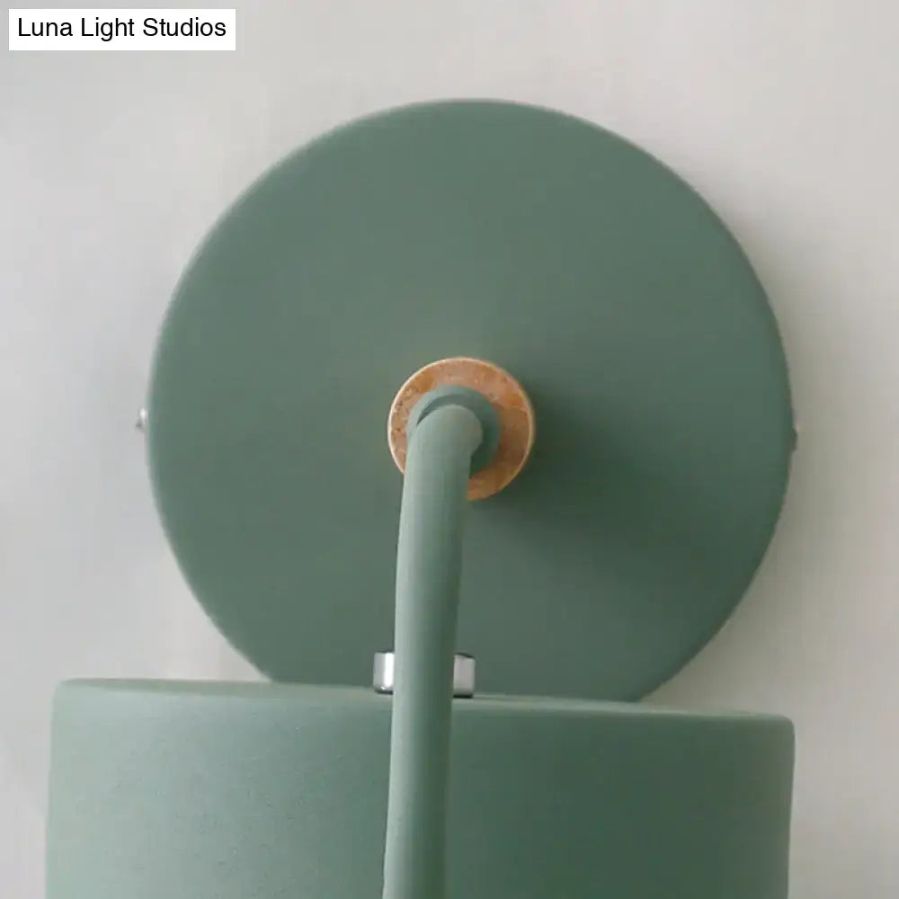 A matte sage green contemporary gray metal wall light with cylindrical shade and wooden accent for 110v-120v and 220v-240v