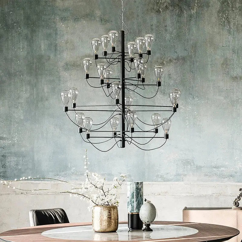 Contemporary iron glass chandelier with tiered clear glass bulbs in black metal ideal for foyer lighting by decorbites contemporary iron