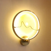 Contemporary jade and gold ring wall lamp with circular brass finish wall mount and elegant mountain wire design