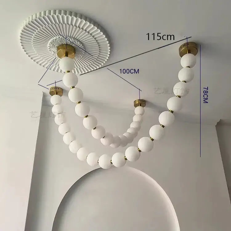 Contemporary led pendant chandelier with white frosted glass spheres gold-toned metal accents and decorative fan-shaped mount