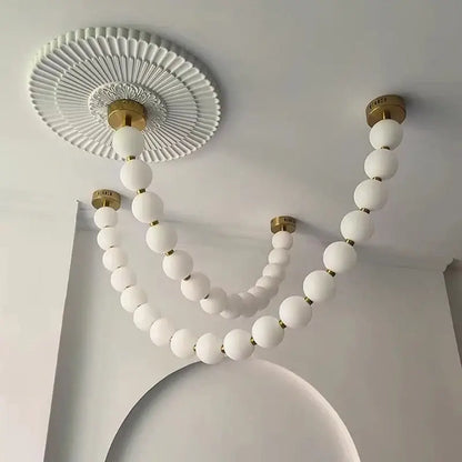 Contemporary led pendant chandelier with white spherical glass beads and brass connectors for dining room decorbites contemporary led