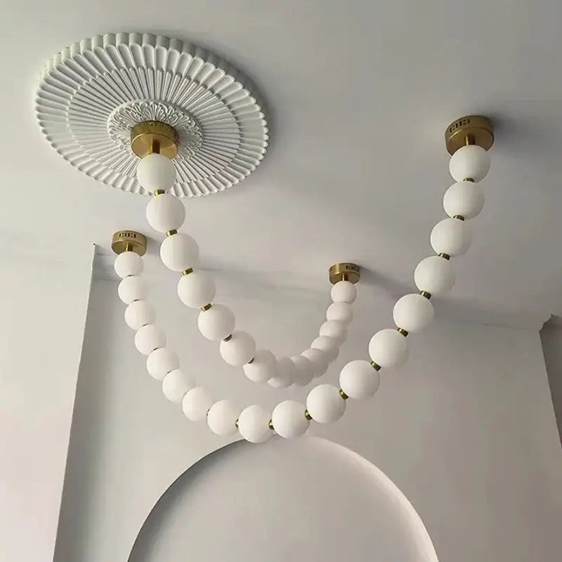 Contemporary led pendant chandelier with white spherical glass beads and brass connectors for dining room decorbites contemporary led