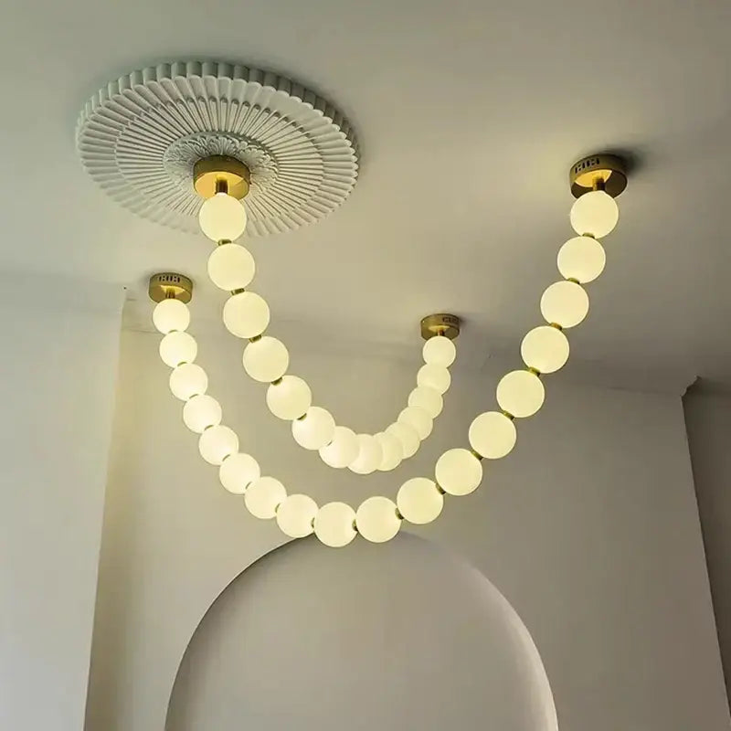 Contemporary led pendant chandelier with gold-toned fixtures and frosted glass spheres for dining room decorbites contemporary led
