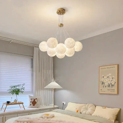 A modern gold moon chandelier with frosted glass orbs designed as contemporary led pendant lights for dining room decorbites contemporary led