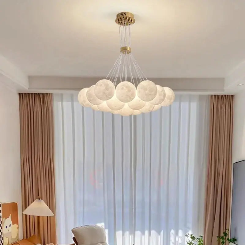 A contemporary led pendant light featuring frosted glass spheres and a gold-toned fixture for dining room decorbites contemporary led