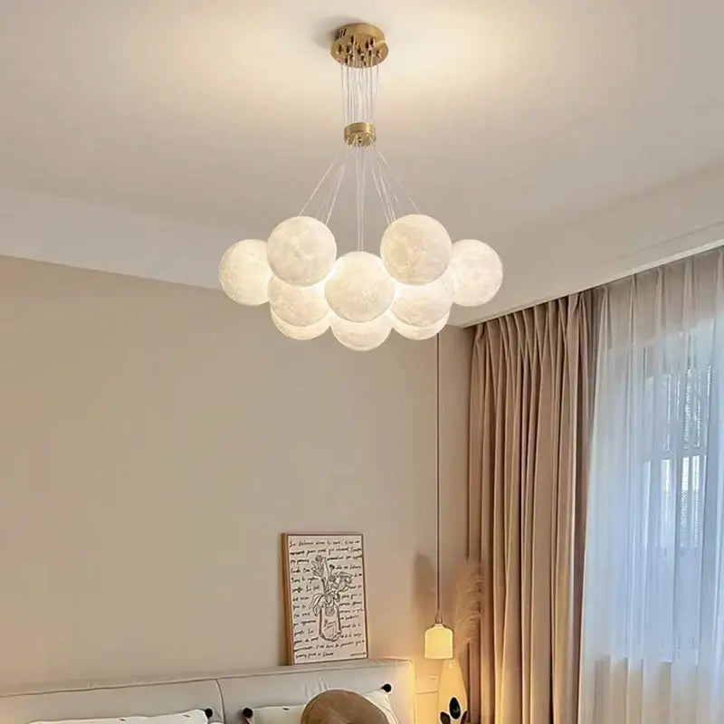 Contemporary led pendant lights gold moon chandelier with textured spherical shades and warm ambient glow for dining room decor
