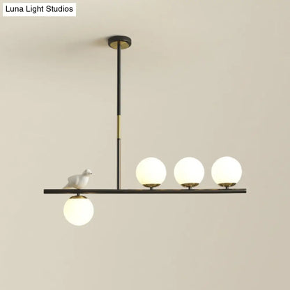 DecorBites™ Contemporary Linear/Branch Dining Room Island Lamp - Cream Glass Ball, 4 Heads, Hanging Pendant with Bird Deco (Black-Gold)
