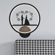Contemporary lover black circular led wall sconce with glowing ring light and floral silhouette for direct wired electric use