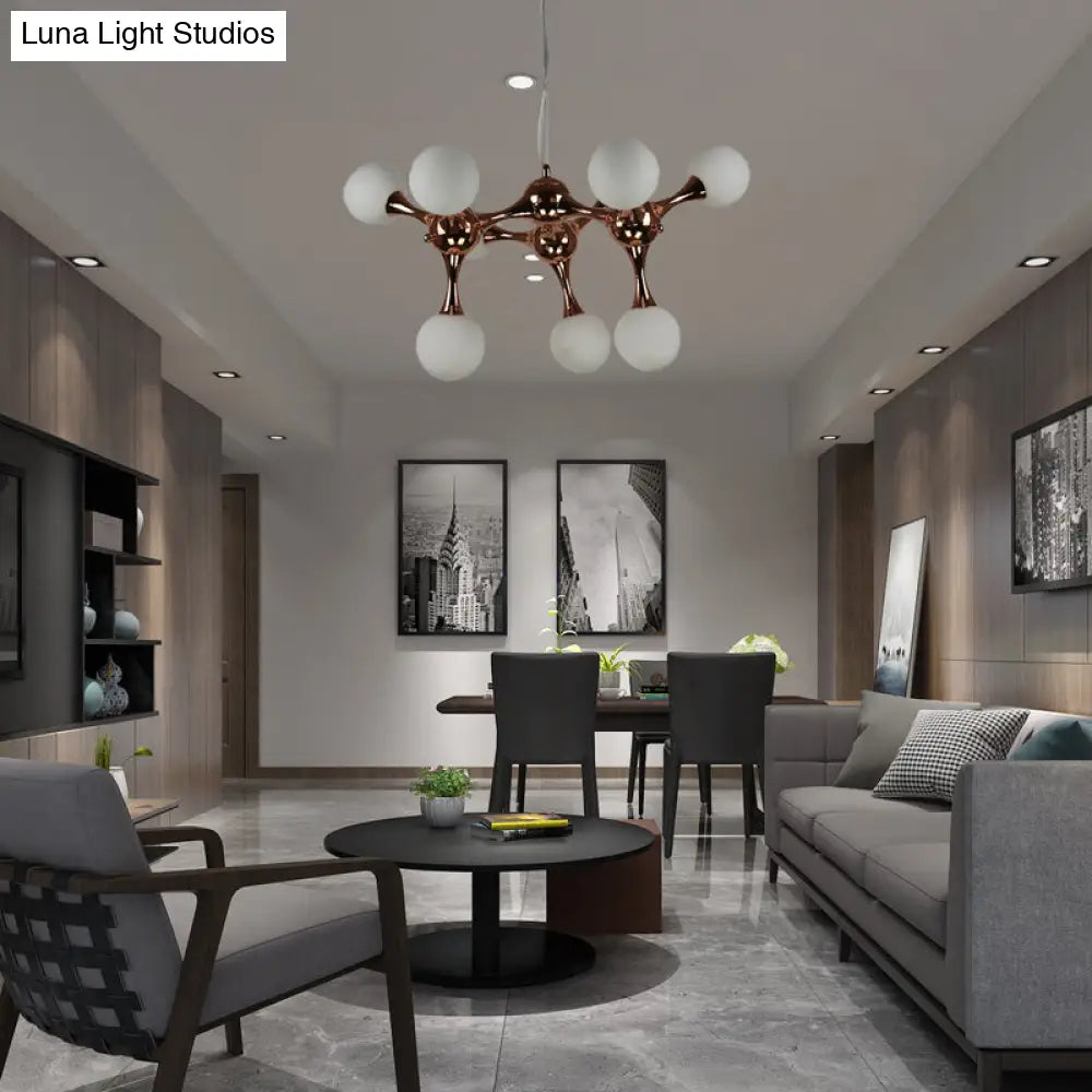 Lámpara de araña contemporánea de metal con 9/15 luces: estilo estrella, acabado en oro rosa, pantalla de cristal blanco con forma de burbuja.