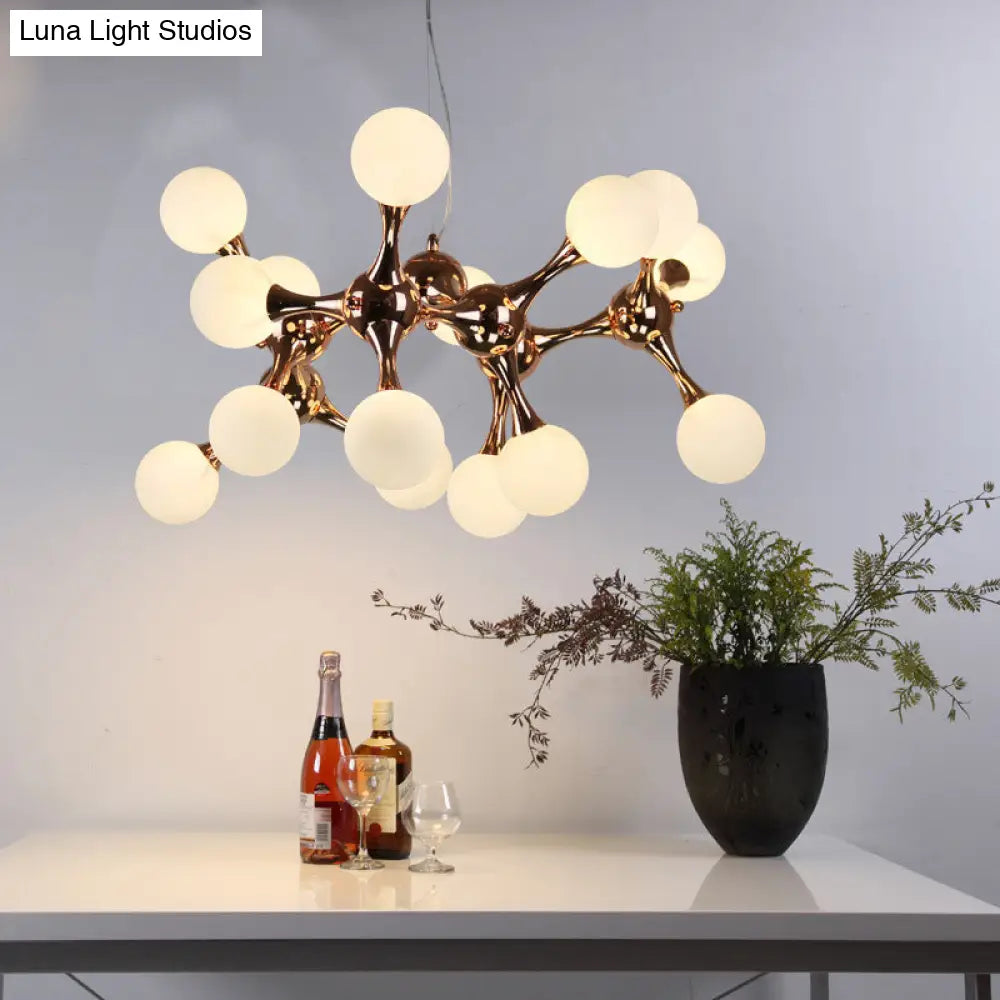 Lámpara de araña contemporánea de metal con 9/15 luces: estilo estrella, acabado en oro rosa, pantalla de cristal blanco con forma de burbuja.