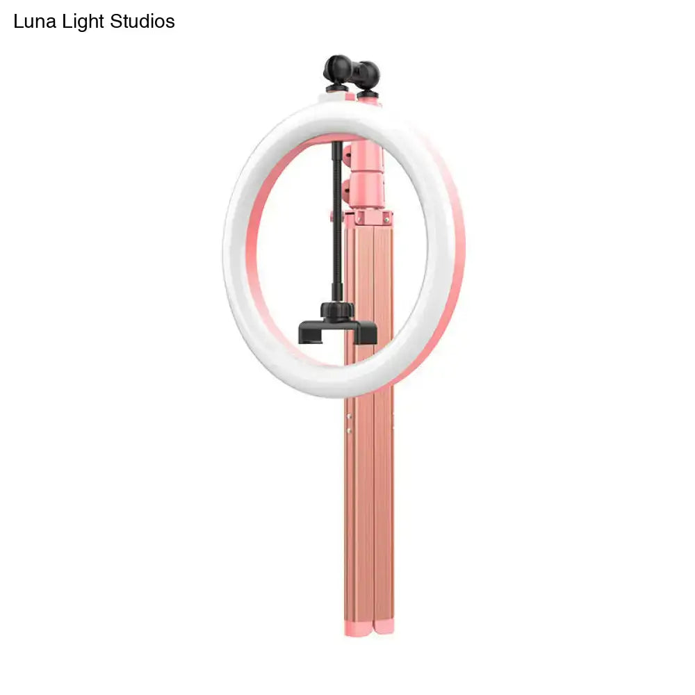 Contemporary pink and black metallic circular mirror lamp with pink and white ring light and collapsible tripod stand