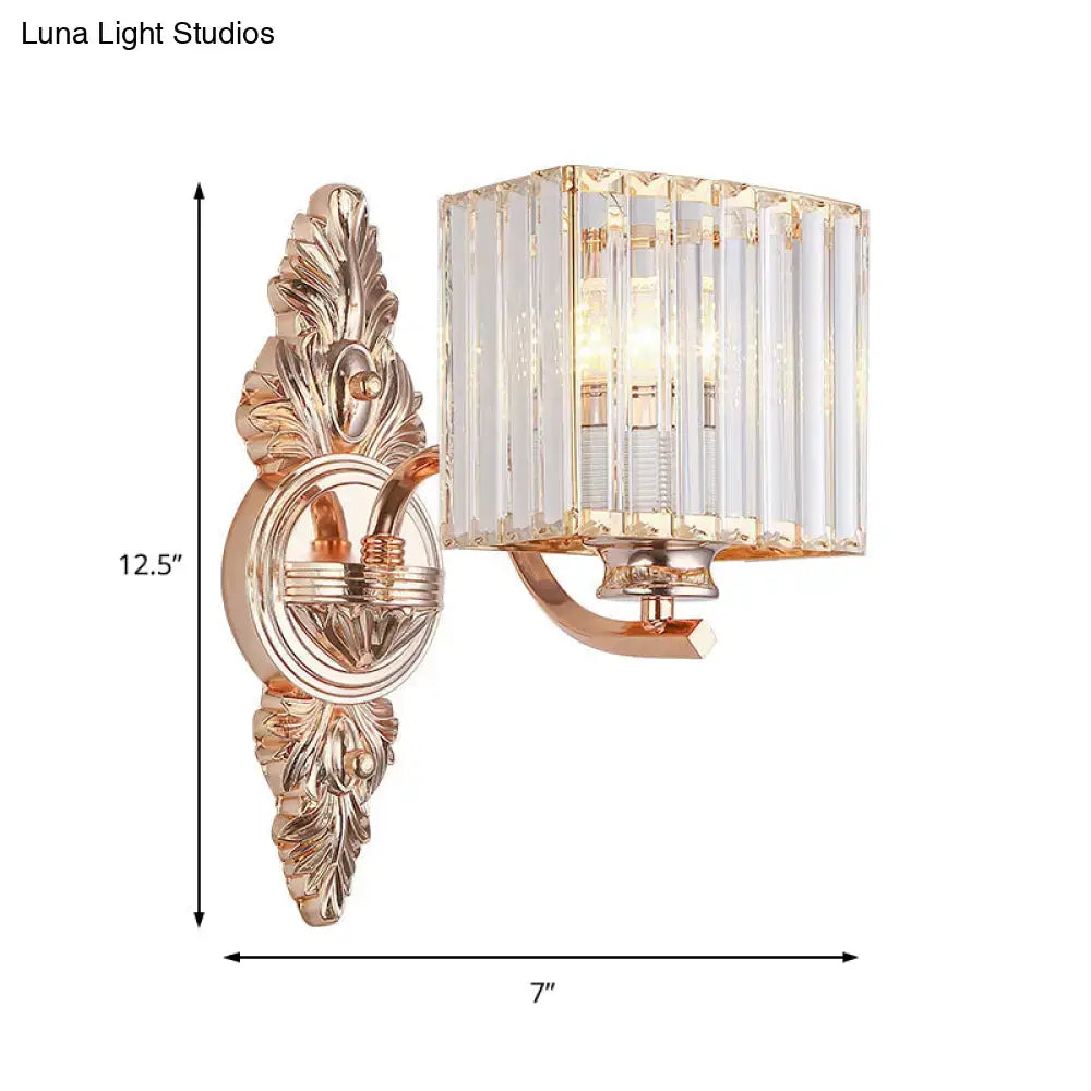 Contemporary rose gold wall sconce with rectangular crystal prism shade and ornate leaf-patterned metalwork for e26 e27 bulbs