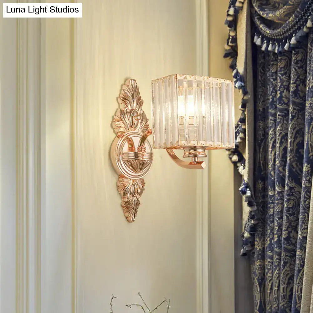 Contemporary rose gold wall sconce with ornate design and rectangular clear crystal shade for e26 e27 bulbs