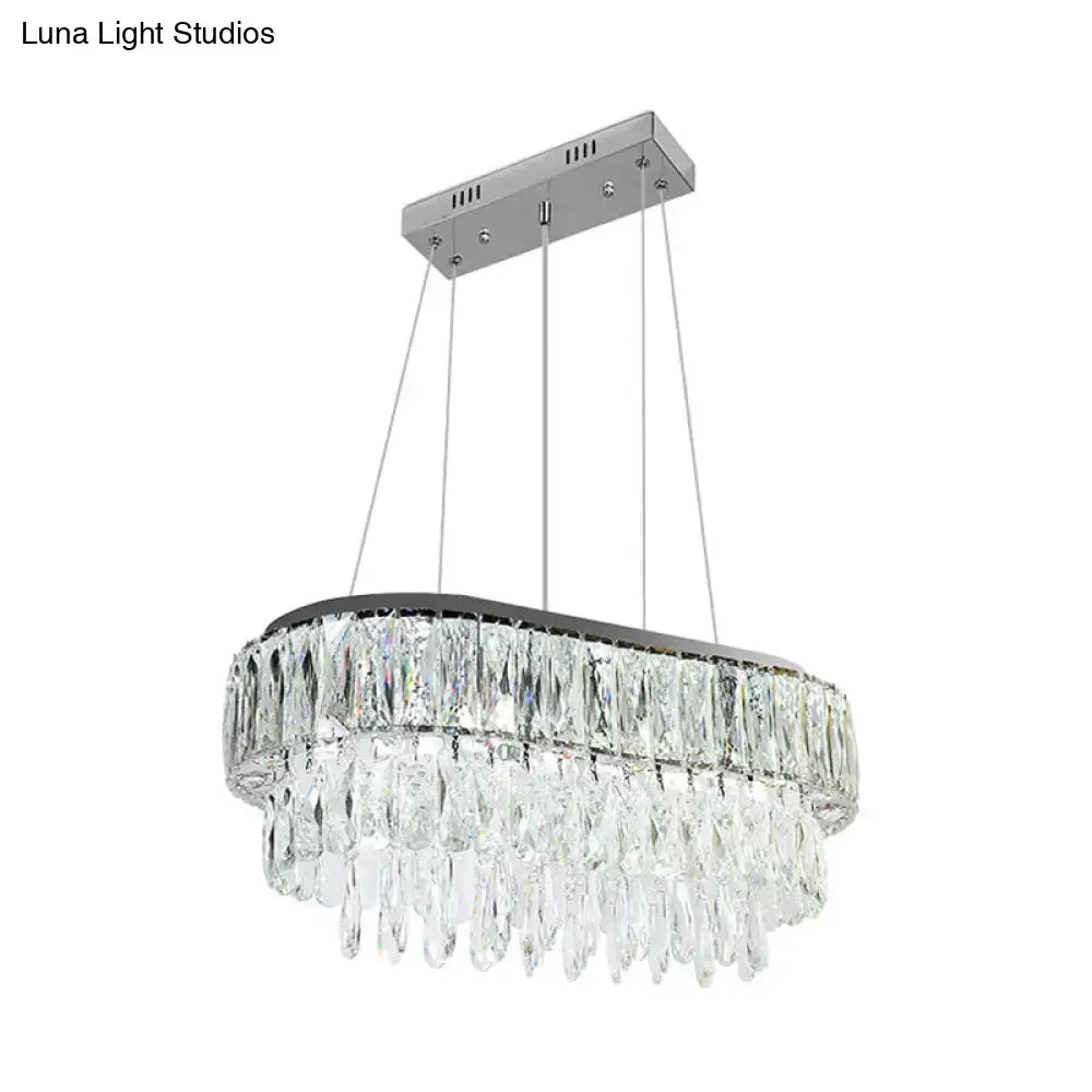 Contemporary silver oval crystal drip pendant light with sleek chrome finish and cascading clear faceted crystals