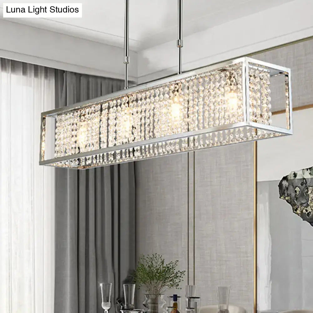 Contemporary silver rectangular chandelier with crystal drops and a sleek chrome frame for dining room lighting
