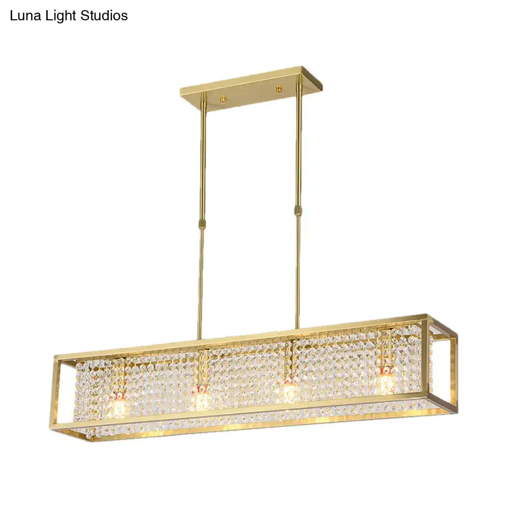 Gold-finished rectangular chandelier with crystal-encrusted frame and three bulbs featuring crystal drops for dining room