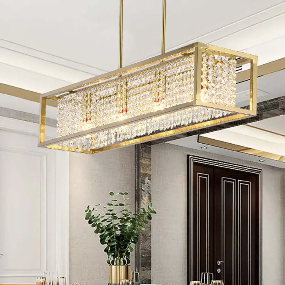 Contemporary gold-framed rectangular chandelier featuring cascading clear crystal drops for dining room lighting