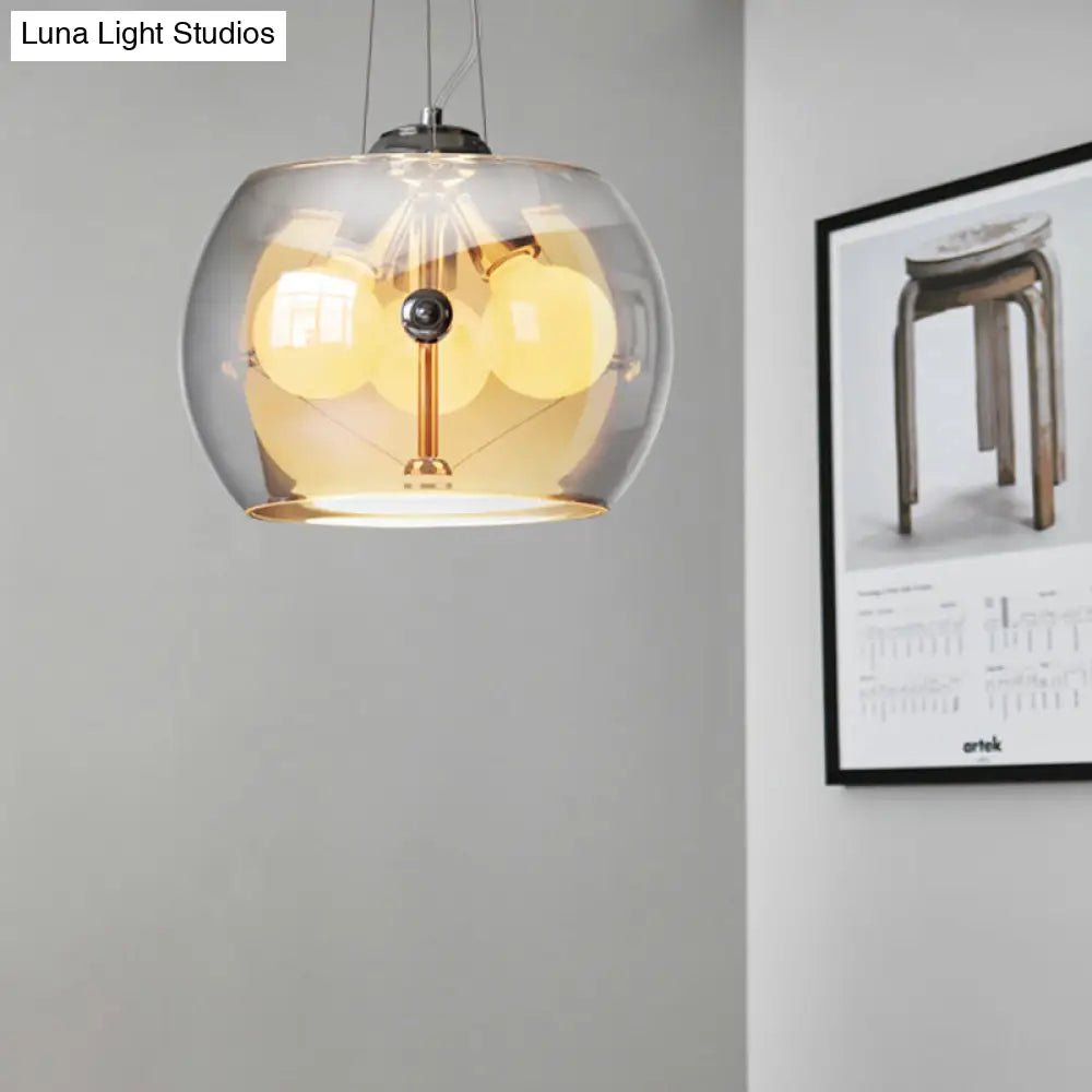 Lámpara de techo colgante contemporánea de cristal gris humo con forma de tambor y tres luces.