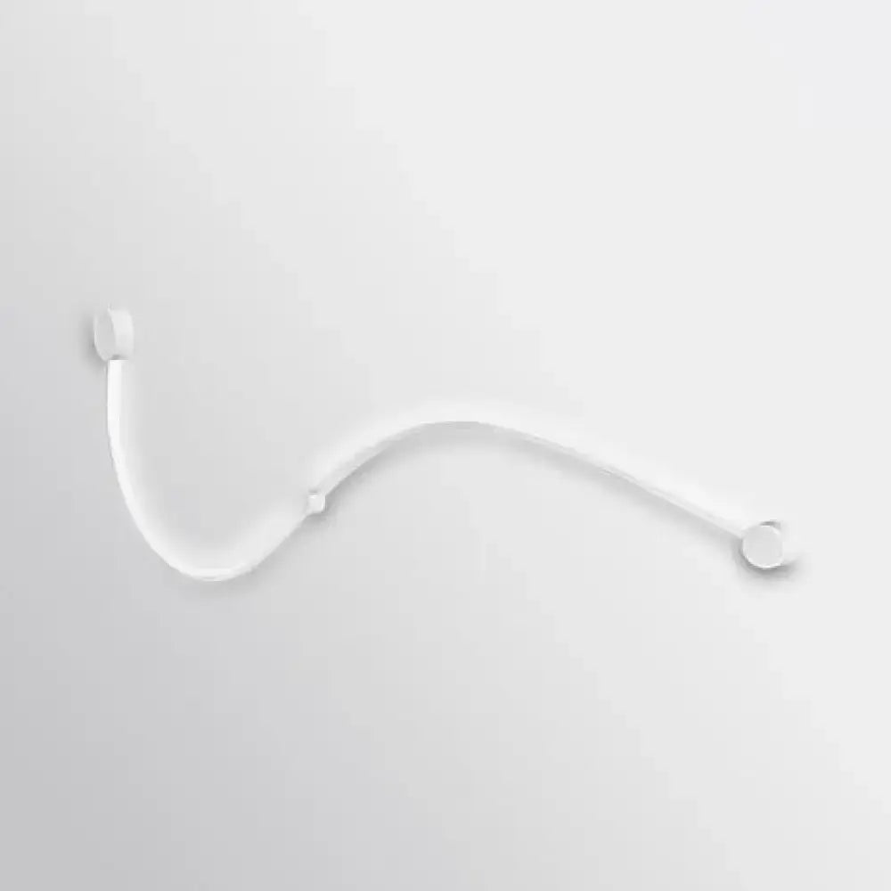 Contemporary twist wall sconce with sleek translucent white plastic zip tie and warm white light for bedroom use