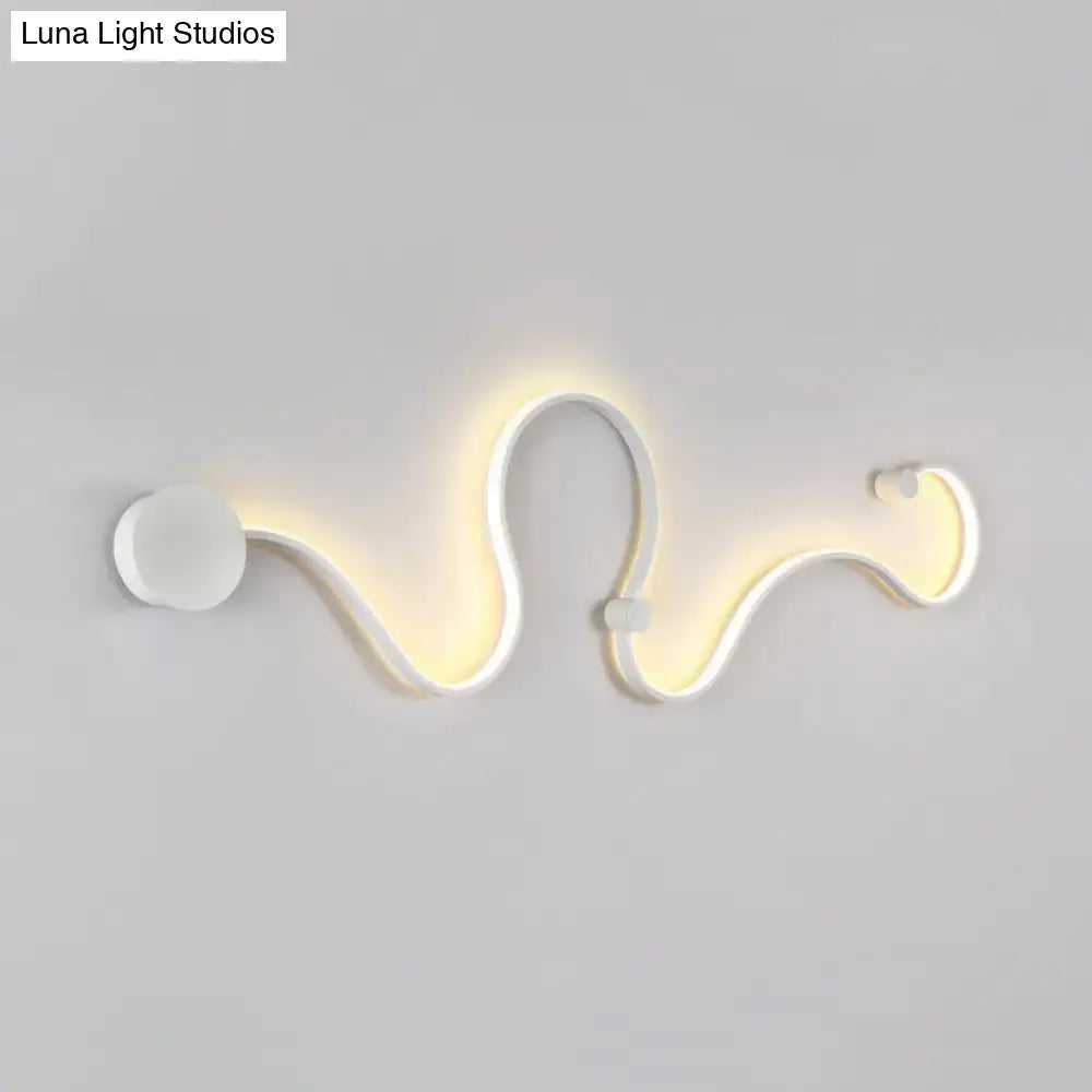 Contemporary twist wall sconce in white with sleek serpentine design and warm white light for bedroom ambiance