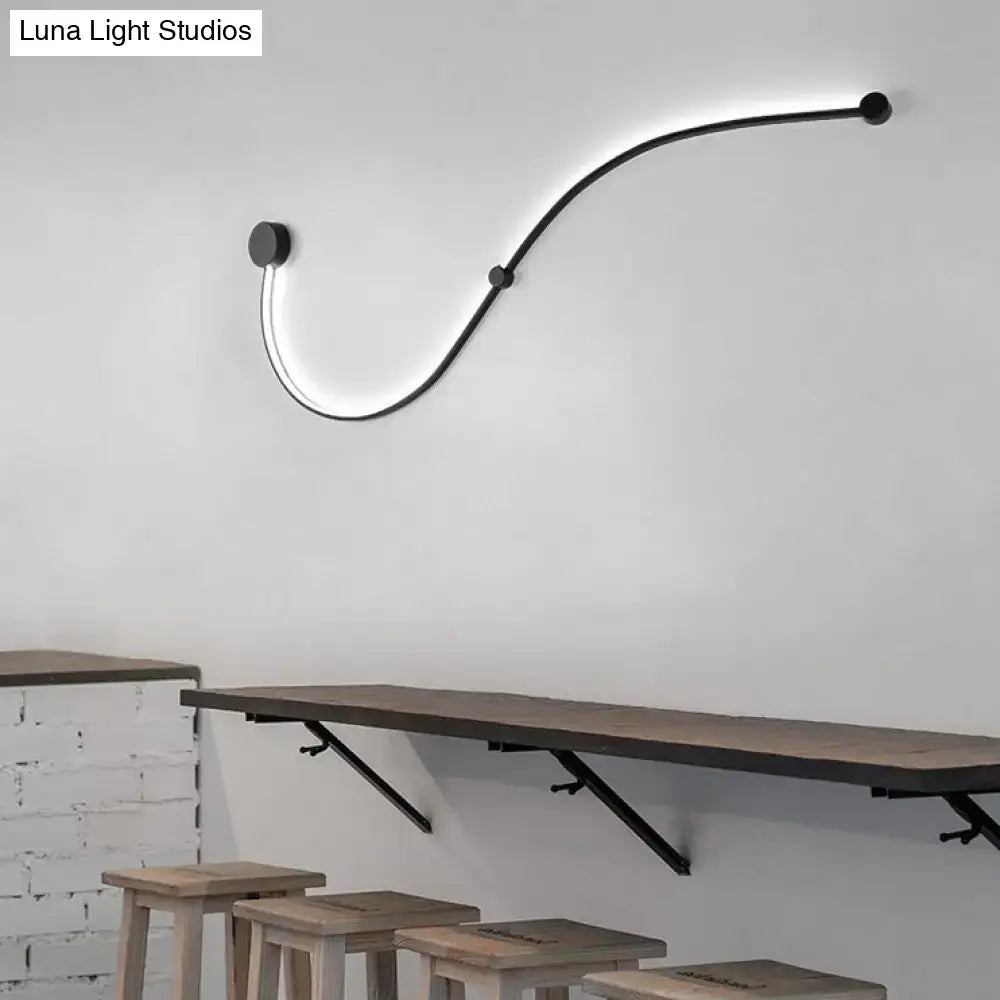 Contemporary twist black curved led wall sconce with sleek minimalist finish and white warm light for bedroom use