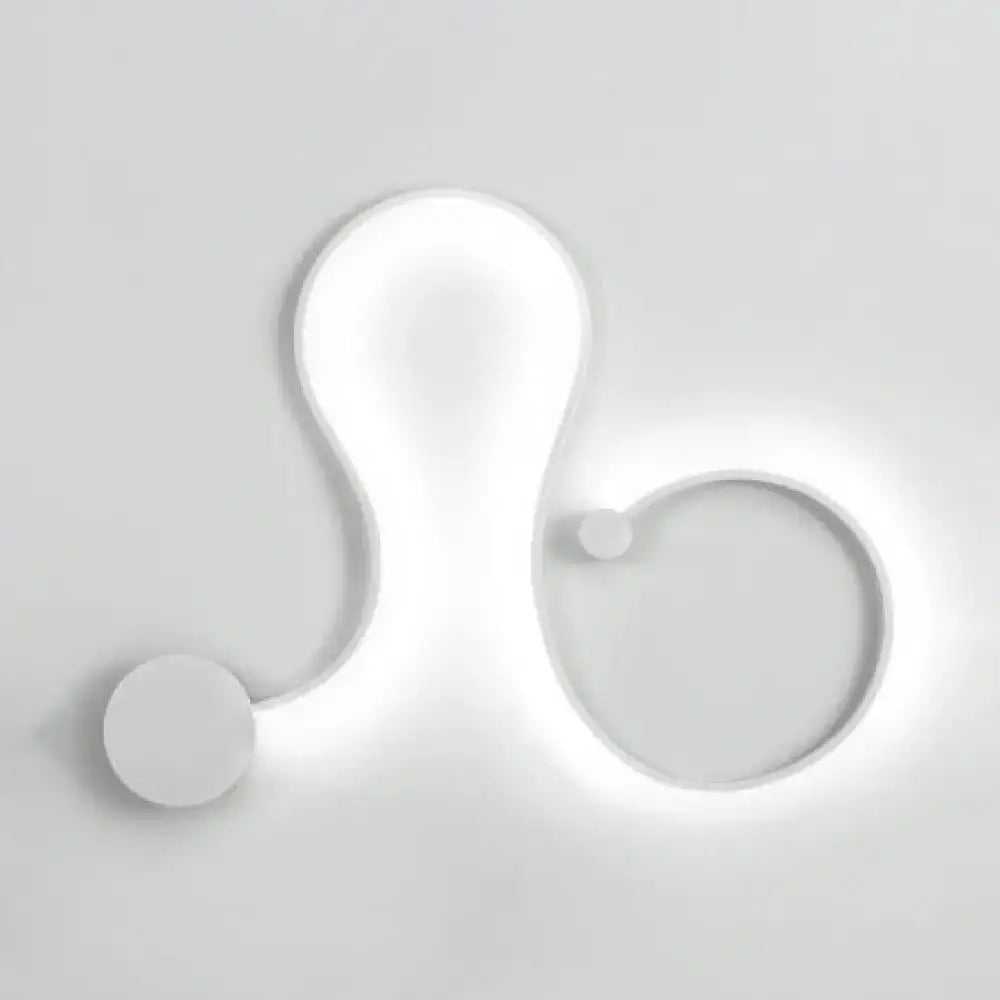 Contemporary twist wall sconce in white with sleek organic curves and warm white light for bedroom use