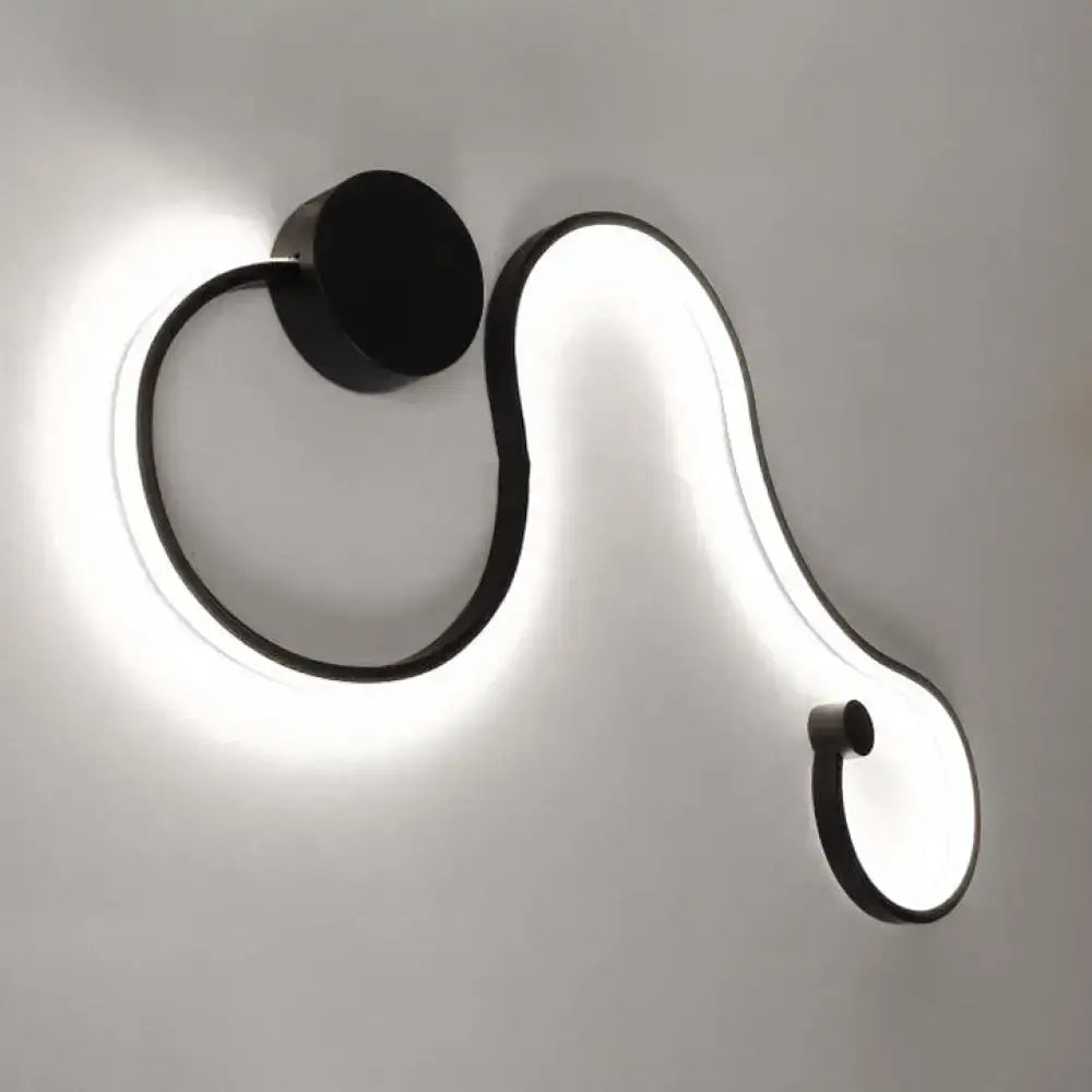Contemporary twist black and white wall sconce with sleek curved design and warm white led light for bedroom use