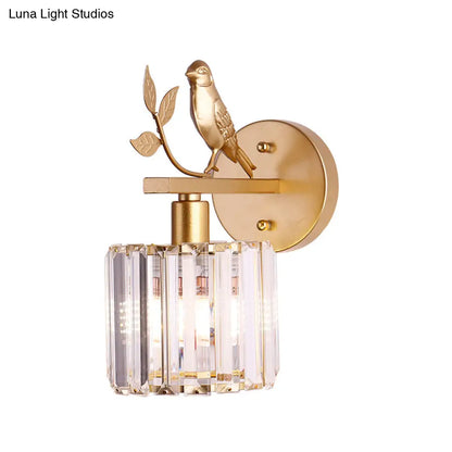 Aplique de pared contemporáneo DecorBites™ con cilindro de cristal K9, detalle de pájaro y acabado negro/dorado.