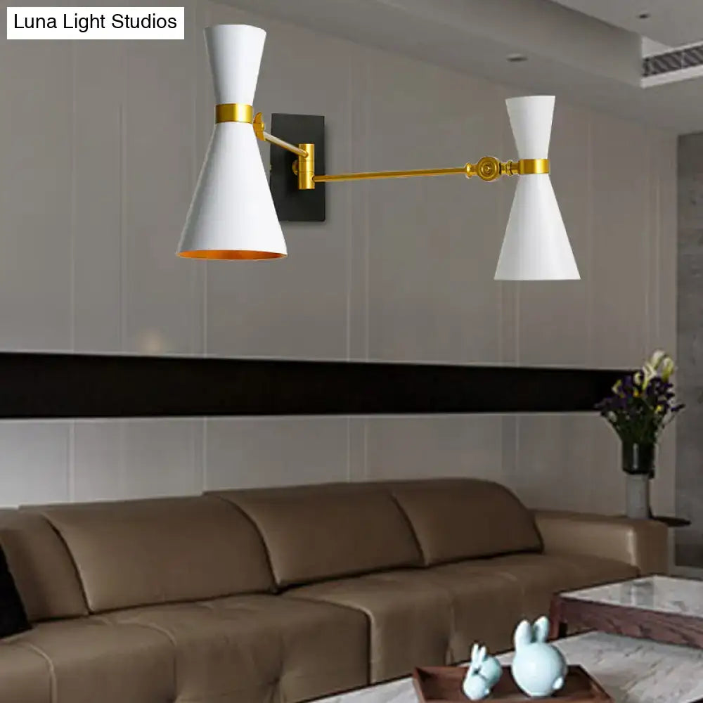 Contemporary white and gold wall sconce with adjustable arm and matte finish for directional bedroom lighting