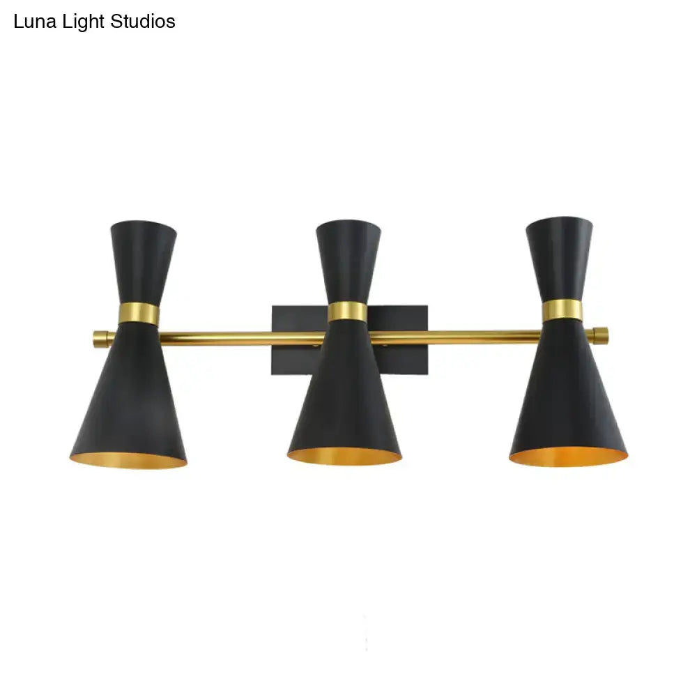 Contemporary black and gold three-light wall sconce with conical shades and adjustable arm for bedroom lighting