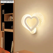 Contemporary white love heart wall mounted light with textured dotted accent panel and soft ambient led lighting