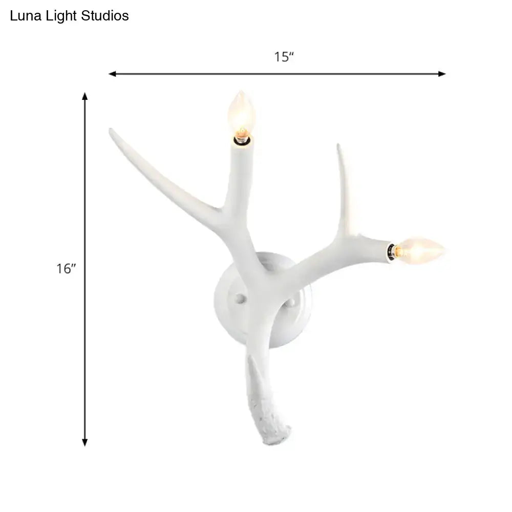 Contemporary white resin antler wall sconce with two illuminated bulbs for restaurant dining room lighting