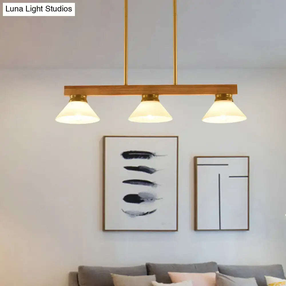 Contemporary wood linear island ceiling light with modern brass finish and gold black pendant shades for dining room