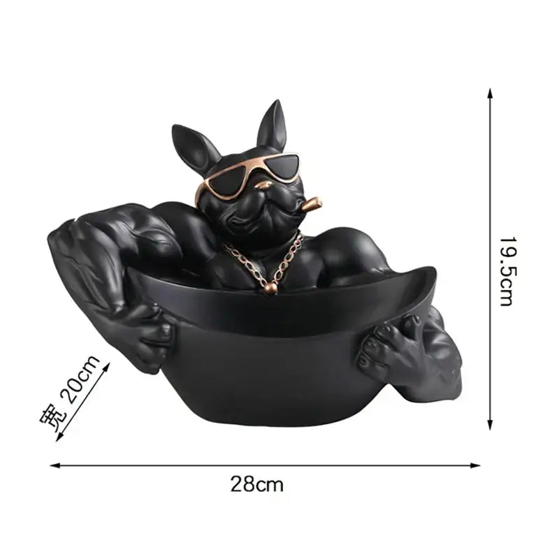 Black resin french bulldog storage box with gold sunglasses and chain lounging in matching black bowl decor