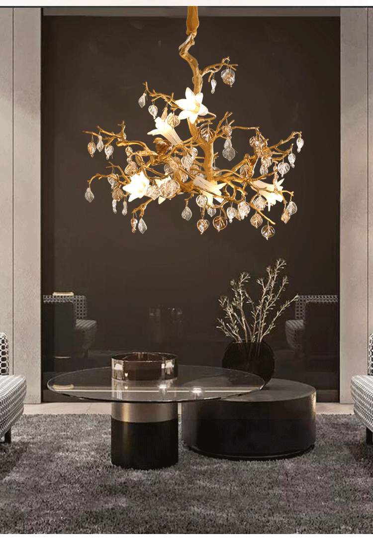 Gold star chandelier with crystal accents and branches.